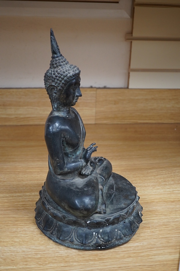 A Thai bronze seated figure of Buddha Shakyamuni, 36cm high. Condition - good